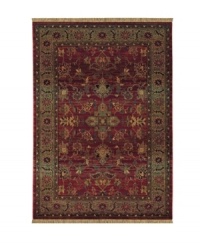A truly charming interpretation of a traditional carpet, this rug features a center medallion ringed by palmettes and floral details in sage green, topaz and slate blue against a rich burgundy ground. Striated effects create the weathered look of handmade rugs in a stain-resistant, no-shed manmade fiber. A truly charming interpretation of a traditional carpet, this rug features a center medallion ringed by palmettes and floral details in sage green, topaz and slate blue against a rich burgundy ground. Striated effects create the weathered look of handmade rugs in a stain-resistant, no-shed manmade fiber.