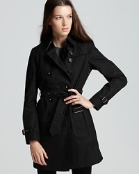 The classic Burberry Brit trench coat gains cold-weather credo with an inner warmer for a cozy yet chic approach to the rainiest of days. The classic Burberry Brit trench coat gains cold-weather credo with an inner warmer for a cozy yet chic approach to the rainiest of days.