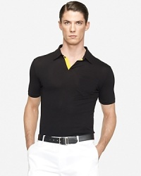 The epitome of sleek, iconic style, a trim-fitting short-sleeved polo shirt is rendered in mercerized cotton mesh with a hint of stretch for a refined finish. The epitome of sleek, iconic style, a trim-fitting short-sleeved polo shirt is rendered in mercerized cotton mesh with a hint of stretch for a refined finish.