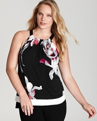 Winter florals bloom against a Tahari Woman Plus blouse, flaunting a chic halter neckline and tiered contrast trim for a modern feminine statement.