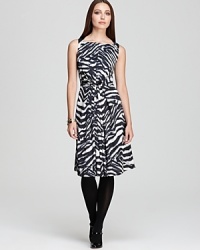 Send your style on an exotic quest in a pleated Jones New York Collection dress enlivened by a wild rush of zebra print. Send your style on an exotic quest in a pleated Jones New York Collection dress enlivened by a wild rush of zebra print.
