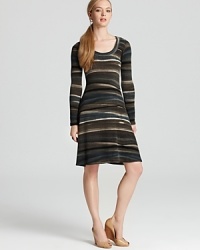 A blaze of graphic stripes infuse this Karen Kane sweater dress with urban edge. Slip a leather jacket over the style for added attitude. A blaze of graphic stripes infuse this Karen Kane sweater dress with urban edge. Slip a leather jacket over the style for added attitude.