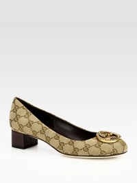 Logo-print canvas pump fronted by an interlocking GG adornment. Stacked heel, 1½ (40mm)Canvas upperLeather lining and solePadded insoleMade in Italy Logo-print canvas pump fronted by an interlocking GG adornment. Stacked heel, 1½ (40mm)Canvas upperLeather lining and solePadded insoleMade in Italy
