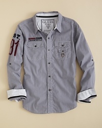 A fitted sport shirt with extra attitude, courtesy of GUESS Kids, the Liberty offers up contrast trim at the cuff, a double chest pocket and retro-inspired embroidery accents at the chest and sleeve. A fitted sport shirt with extra attitude, courtesy of GUESS Kids, the Liberty offers up contrast trim at the cuff, a double chest pocket and retro-inspired embroidery accents at the chest and sleeve.