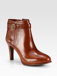 A stacked heel and hidden platform lift this leather design with a lustrous goldtone logo-detail and side zip. Stacked heel, 3½ (90mm)Hidden platform, ½ (15mm)Compares to a 3 heel (75mm)Leather upperSide zipLeather liningRubber solePadded insoleImported A stacked heel and hidden platform lift this leather design with a lustrous goldtone logo-detail and side zip. Stacked heel, 3½ (90mm)Hidden platform, ½ (15mm)Compares to a 3 heel (75mm)Leather upperSide zipLeather liningRubber solePadded insoleImported