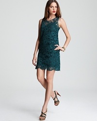 A decadent jewel tone imparts lush dimension to a lace DKNY sheath dress. Garnish with gold accents and hit the party circuit with captivating sophistication. A decadent jewel tone imparts lush dimension to a lace DKNY sheath dress. Garnish with gold accents and hit the party circuit with captivating sophistication.