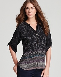 Punctuated with tiny scattered dots, this elegant Yumi Kim top defines casual-chic in pure silk. Punctuated with tiny scattered dots, this elegant Yumi Kim top defines casual-chic in pure silk.