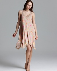 A flowy floral print chemise with an asymmetrical hem from Midnight by Carole Hochman. A flowy floral print chemise with an asymmetrical hem from Midnight by Carole Hochman.
