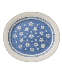 Vintage charm meets modern durability in the Farmhouse Touch oval platter, featuring cornflower-blue laurels and blooms in premium porcelain from Villeroy & Boch. Vintage charm meets modern durability in the Farmhouse Touch oval platter, featuring cornflower-blue laurels and blooms in premium porcelain from Villeroy & Boch.