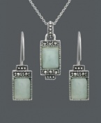 Express peace and tranquility in the form of pale, green hues. Cabochon jade stones (7 mm x 9 mm and 5 mm x 7 mm) make a serene statement when framed by the subtle glitter of marcasite. Genevieve & Grace set crafted in sterling silver. Approximate necklace length: 18 inches. Approximate pendant drop: 1 inch. Approximate earring drop: 1 inch.