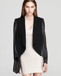 Leather and silk make a luxe pairing on Jay Godfrey's mixed media jacket, exuding a laid-back look in a draped silhouette. Leather and silk make a luxe pairing on Jay Godfrey's mixed media jacket, exuding a laid-back look in a draped silhouette.