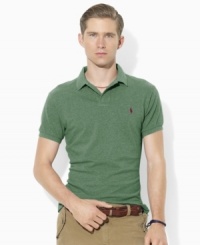 A trim-fitting short-sleeved polo shirt is rendered in breathable cotton mesh with Ralph Lauren's signature embroidery for iconic style. A trim-fitting short-sleeved polo shirt is rendered in breathable cotton mesh with Ralph Lauren's signature embroidery for iconic style.
