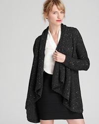 A dash of sequins enlivens the classic C by Bloomingdale's cashmere cardigan. Slip it on and step into the spotlight. A dash of sequins enlivens the classic C by Bloomingdale's cashmere cardigan. Slip it on and step into the spotlight.