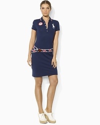 In celebration of Team USA's participation in the 2012 Olympics, a figure-flattering polo dress in stretch cotton mesh is adorned with bold country embroidery. In celebration of Team USA's participation in the 2012 Olympics, a figure-flattering polo dress in stretch cotton mesh is adorned with bold country embroidery.