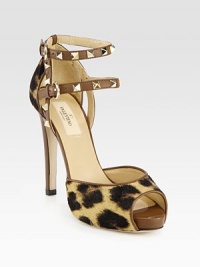 A tall, feline-inspired silhouette, pairing lush calf hair with smooth leather trim and signature metal studs. Leather-covered heel with metal studs, 4¾ (120mm)Hidden platform, 1 (25mm)Compares to a 3¾ heel (50mm)Calf hair and leather upper with metal studsAdjustable ankle strapsLeather lining and solePadded insoleMade in Italy A tall, feline-inspired silhouette, pairing lush calf hair with smooth leather trim and signature metal studs. Leather-covered heel with metal studs, 4¾ (120mm)Hidden platform, 1 (25mm)Compares to a 3¾ heel (50mm)Calf hair and leather upper with metal studsAdjustable ankle strapsLeather lining and solePadded insoleMade in Italy