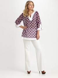 From its spectacular print to its exquisite beading this top embodies the perfect union of luxury and comfort.Stunning beaded necklineThree-quarter sleevesSplit cuffsFrench bust dartsSide slitsPull-on styleAbout 30 from shoulder to hem70% cotton/30% silkDry cleanImported of Italian fabric From its spectacular print to its exquisite beading this top embodies the perfect union of luxury and comfort.Stunning beaded necklineThree-quarter sleevesSplit cuffsFrench bust dartsSide slitsPull-on styleAbout 30 from shoulder to hem70% cotton/30% silkDry cleanImported of Italian fabric