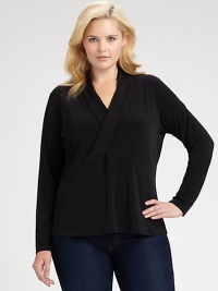 Understated and graceful, this sleek knit top has unlimited wardrobing possibilities.V necklineCrossover surplice bodiceEmpire seamed waistLong sleevesPolyester/elastaneDry cleanImported Understated and graceful, this sleek knit top has unlimited wardrobing possibilities.V necklineCrossover surplice bodiceEmpire seamed waistLong sleevesPolyester/elastaneDry cleanImported