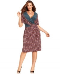 Jones New York's plus size dress is captivating with a faux-wrap silhouette and vibrant, contrasting print at the neck and waist. Jones New York's plus size dress is captivating with a faux-wrap silhouette and vibrant, contrasting print at the neck and waist.