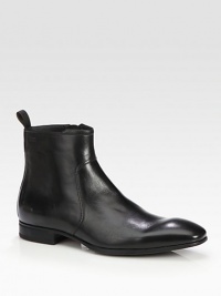 A sleek and modern chelsea boot design constructed in luxurious leather with size-zip and ankle pull-tab detail.Leather upperLeather liningPadded insoleRubber soleImported A sleek and modern chelsea boot design constructed in luxurious leather with size-zip and ankle pull-tab detail.Leather upperLeather liningPadded insoleRubber soleImported