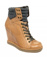 High and mighty--and totally on trend. Report's Daysha wedge sneakers feature a lace-up vamp and puffy ankle detail.