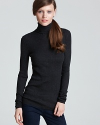 Flaunt your contours in this curve-skimming Vince ribbed sweater and add a soft touch to your favorite skinnies. Flaunt your contours in this curve-skimming Vince ribbed sweater and add a soft touch to your favorite skinnies.