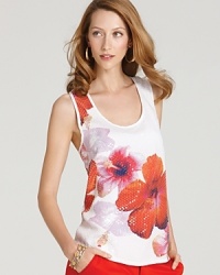 This VINCE CAMUTO tank shows you a new way to wear flowers with a vibrant hibiscus print that's drenched in clear sequins for added glamour. This VINCE CAMUTO tank shows you a new way to wear flowers with a vibrant hibiscus print that's drenched in clear sequins for added glamour.