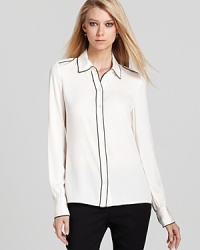Rachel Zoe reinvents the classic button down with chic contrast piping and shoulder-squaring epaulets. Rachel Zoe reinvents the classic button down with chic contrast piping and shoulder-squaring epaulets.