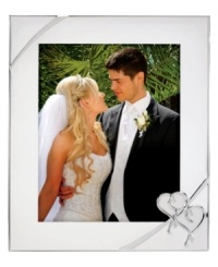 Preserve a cherished moment of your own or treat your favorite newlyweds to the True Love picture frame. Interlocking hearts adorn elegant silver plate, a beautiful showcase for wedding or honeymoon photos. Preserve a cherished moment of your own or treat your favorite newlyweds to the True Love picture frame. Interlocking hearts adorn elegant silver plate, a beautiful showcase for wedding or honeymoon photos.