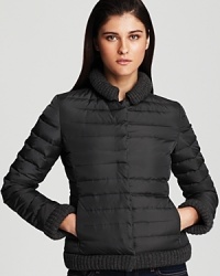 With soft grey knit accents, this Armani Collezioni short down coat gets cozy for cold-weather with an insulating goose feather fill. With soft grey knit accents, this Armani Collezioni short down coat gets cozy for cold-weather with an insulating goose feather fill.