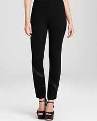 Leather trim outfits these sleek DKNY leggings with pure urban edge. Style with strappy sandals and rock n' roll to the top of the fashion set. Leather trim outfits these sleek DKNY leggings with pure urban edge. Style with strappy sandals and rock n' roll to the top of the fashion set.