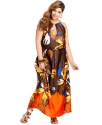 Spice it up with Baby Phat's plus size maxi dress, featuring a bold floral print and eye-catching halter neckline with shimmering gold rope details. Spice it up with Baby Phat's plus size maxi dress, featuring a bold floral print and eye-catching halter neckline with shimmering gold rope details.