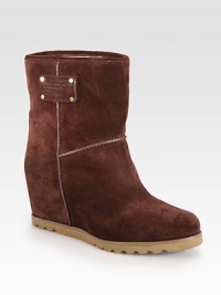 Fine leather trim and a signature logo detail tops this suede go-to, resting on a hidden wedge. Hidden wedge, 3¼ (80mm)Rubber platform, ½ (15mm)Compares to a 2¾ heel (70mm)Shaft, 5½Leg circumference, 11½Suede upper with leather trimPull-on styleLeather liningRubber trek solePadded insoleImported Fine leather trim and a signature logo detail tops this suede go-to, resting on a hidden wedge. Hidden wedge, 3¼ (80mm)Rubber platform, ½ (15mm)Compares to a 2¾ heel (70mm)Shaft, 5½Leg circumference, 11½Suede upper with leather trimPull-on styleLeather liningRubber trek solePadded insoleImported