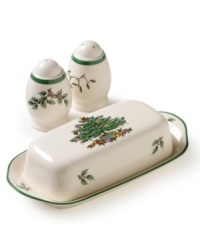 A covered butter dish and salt and pepper shakers featuring Spode's beloved Christmas Tree pattern. The butter dish boasts the signature full evergreen tree impeccably decorated with baubles and tinsel, with gifts placed underneath. The shakers are enlivened with sprigs of holly and ivy. Butter dish measures 8 in length. A covered butter dish and salt and pepper shakers featuring Spode's beloved Christmas Tree pattern. The butter dish boasts the signature full evergreen tree impeccably decorated with baubles and tinsel, with gifts placed underneath. The shakers are enlivened with sprigs of holly and ivy. Butter dish measures 8 in length.