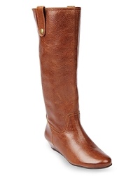 This riding boot-influenced STEVEN BY STEVE MADDEN style features tab details set on downtown-style wedges. This riding boot-influenced STEVEN BY STEVE MADDEN style features tab details set on downtown-style wedges.