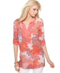 Calvin Klein Jeans' tunic is a beautiful burst of bright colors with its floral-inspired print and solid, coral-hued trim. Totally flawless when worn with skinny white jeans. Calvin Klein Jeans' tunic is a beautiful burst of bright colors with its floral-inspired print and solid, coral-hued trim. Totally flawless when worn with skinny white jeans.
