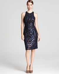 Swirling sequins lend sparkle to a sporty racerback silhouette from David Meister. Swirling sequins lend sparkle to a sporty racerback silhouette from David Meister.