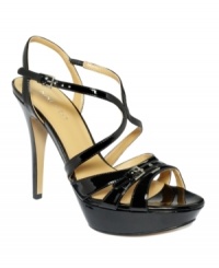 Sink your teeth into this delectable design from Nine West. The Bitten sandal mesmerizes with a strappy vamp, sitting atop a covered platform. Sink your teeth into this delectable design from Nine West. The Bitten sandal mesmerizes with a strappy vamp, sitting atop a covered platform.