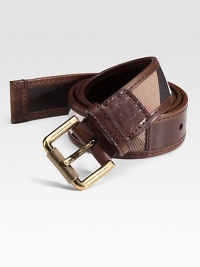 Smooth leather design accented by iconic check pattern.Leather and cottonAbout 1¼ wideMade in Italy Smooth leather design accented by iconic check pattern.Leather and cottonAbout 1¼ wideMade in Italy