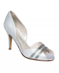 Elegance with an edge. The Xiomara pumps by Caparros feature a classic evening silhouette in satin with bejeweled straps across the vamp. Elegance with an edge. The Xiomara pumps by Caparros feature a classic evening silhouette in satin with bejeweled straps across the vamp.