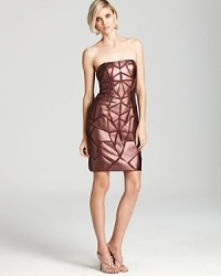 Leather-like metallic triangles lend a modern, geometric look to a strapless Aidan Mattox dress. Leather-like metallic triangles lend a modern, geometric look to a strapless Aidan Mattox dress.