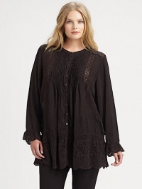 Beyond beautiful, an airy tunic featuring classic eyelet and pretty embroidery. Simply wear it with skinny pants or leggings. Round neckLong sleevesButton frontEyelet/scalloped trimPull-on styleHi-lo hemAbout 32 from shoulder to hemRayonMachine washImported Beyond beautiful, an airy tunic featuring classic eyelet and pretty embroidery. Simply wear it with skinny pants or leggings. Round neckLong sleevesButton frontEyelet/scalloped trimPull-on styleHi-lo hemAbout 32 from shoulder to hemRayonMachine washImported