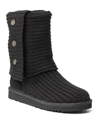 Knit fabric upper, flex rubber sole. Suede trim. Shearling footbed, functional buttons. Can be worn cuffed or not. Knit fabric upper, flex rubber sole. Suede trim. Shearling footbed, functional buttons. Can be worn cuffed or not.