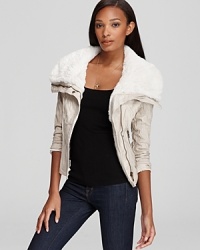 Right on trend for fall, the oh-so feminine, cropped silhouette of this uber-stylish GUESS jacket has arrived--fashioned with a lofty faux shearling collar and zipper details for warmth and modern edge. Right on trend for fall, the oh-so feminine, cropped silhouette of this uber-stylish GUESS jacket has arrived--fashioned with a lofty faux shearling collar and zipper details for warmth and modern edge.