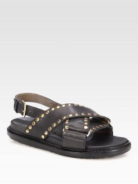 Crisscrossed leather essential with gleaming metal studs for an edgy-chic look. Rubber heel, ¾ (20mm)Leather upper with brass studsAdjustable ankle strapLeather liningRubber solePadded insoleMade in Italy Crisscrossed leather essential with gleaming metal studs for an edgy-chic look. Rubber heel, ¾ (20mm)Leather upper with brass studsAdjustable ankle strapLeather liningRubber solePadded insoleMade in Italy