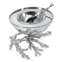 The perfect dish for caviar and other delicacies from the sea. Coral branches out from the highly reflective nested serving dish - and forms the handle of the spoon - to evoke the depth and shimmer of the ocean environment. The perfect dish for caviar and other delicacies from the sea. Coral branches out from the highly reflective nested serving dish - and forms the handle of the spoon - to evoke the depth and shimmer of the ocean environment.