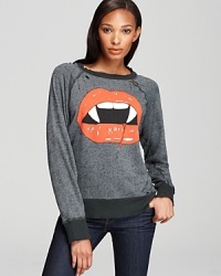 Expect wide smiles and a few double takes when sporting this striking Wildfox top--you don't have to be vampire-obsessed to love this shirt. Expect wide smiles and a few double takes when sporting this striking Wildfox top--you don't have to be vampire-obsessed to love this shirt.