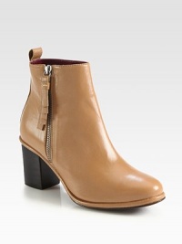 A fringe-detailed zipper adds a touch of edge to this must-have silhouette in smooth nappa leather. Stacked heel, 3 (75mm)Leather upperExposed side zipLeather lining and solePadded insoleImported A fringe-detailed zipper adds a touch of edge to this must-have silhouette in smooth nappa leather. Stacked heel, 3 (75mm)Leather upperExposed side zipLeather lining and solePadded insoleImported