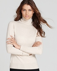 Cozy meets chic as sumptuous wool outfits a sleek Lafayette 148 New York turtleneck. Cozy meets chic as sumptuous wool outfits a sleek Lafayette 148 New York turtleneck.