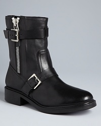 So moto: Pour La Victoire makes a clear statement in these bold booties, with gleaming, chunky zippers and buckled-up hardware. So moto: Pour La Victoire makes a clear statement in these bold booties, with gleaming, chunky zippers and buckled-up hardware.
