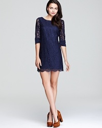 In classic navy, Shoshanna's Patricia dress is crafted in ladylike lace, showcasing delicate, sheer sleeves and a scalloped hem. In classic navy, Shoshanna's Patricia dress is crafted in ladylike lace, showcasing delicate, sheer sleeves and a scalloped hem.